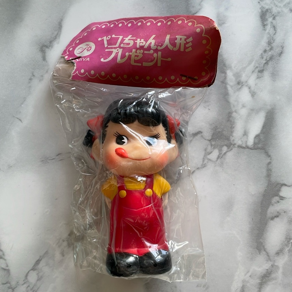 Vintage Peko-chan sofubi squeaker figure. ASIS